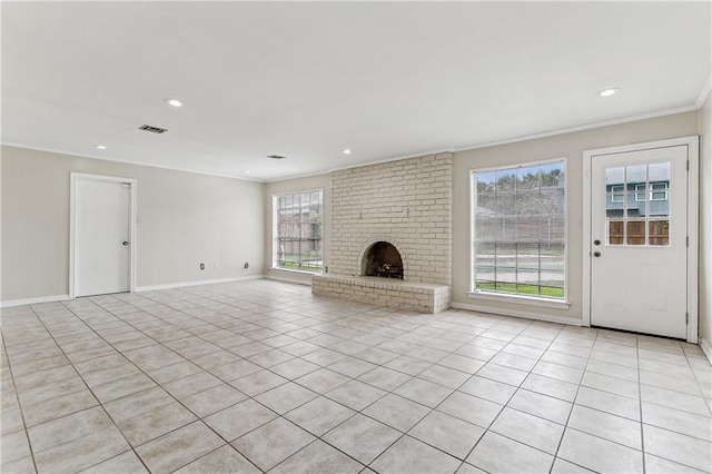 unfurnished living room with a wealth of natural light, light tile patterned floors, and a fireplace