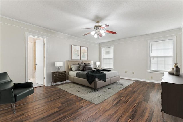 bedroom with ceiling fan, connected bathroom, and dark hardwood / wood-style floors