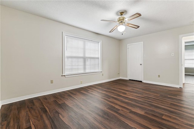 unfurnished room featuring ceiling fan, dark hardwood / wood-style flooring, and a textured ceiling