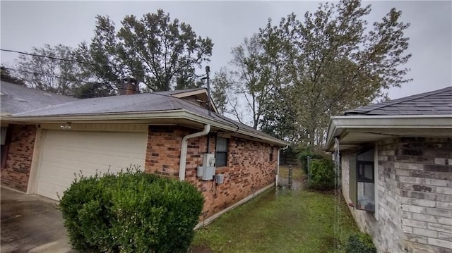 view of side of home featuring a garage