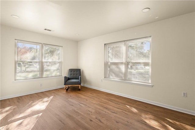 unfurnished room featuring hardwood / wood-style floors