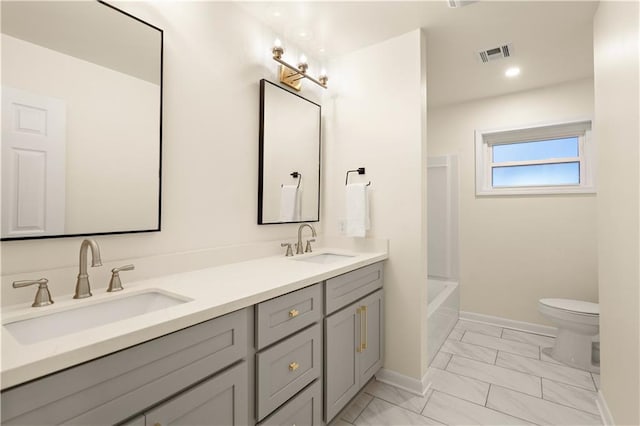 full bathroom with vanity,  shower combination, and toilet