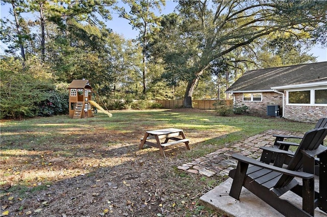 view of yard with cooling unit and a playground