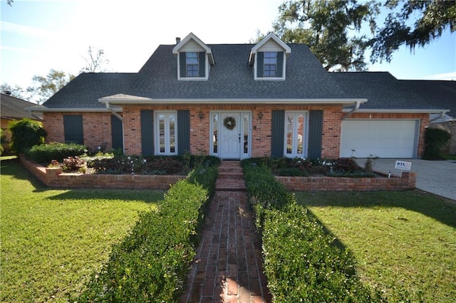 view of front of property featuring a garage and a front lawn