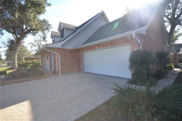 view of side of property featuring a garage