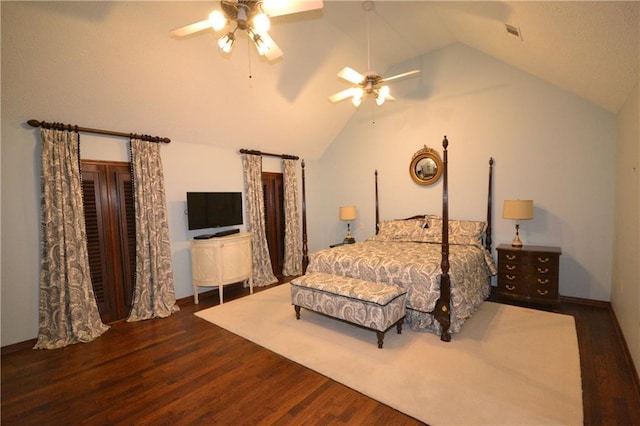 bedroom featuring ceiling fan, dark hardwood / wood-style flooring, and vaulted ceiling