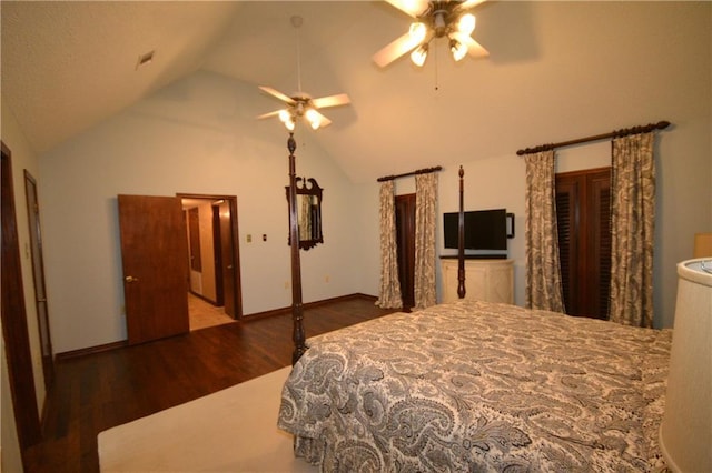 bedroom with ceiling fan, lofted ceiling, and dark wood-type flooring