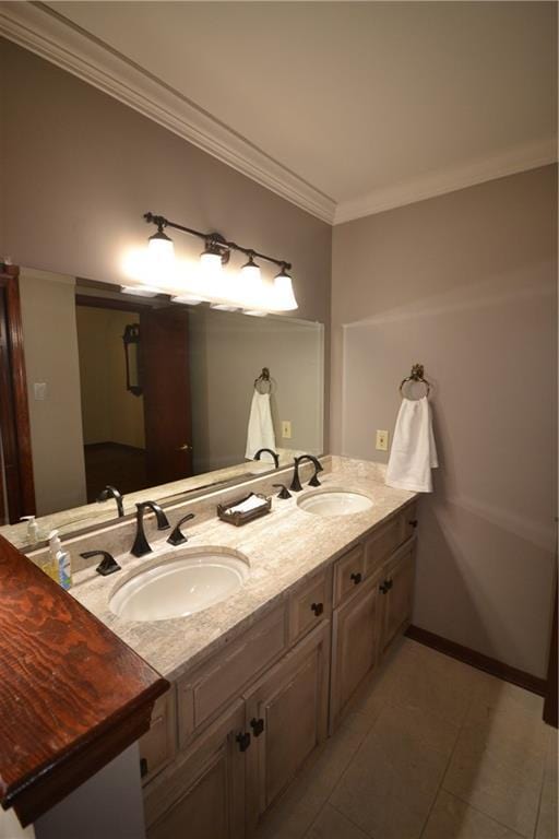 bathroom with tile patterned flooring, vanity, and ornamental molding