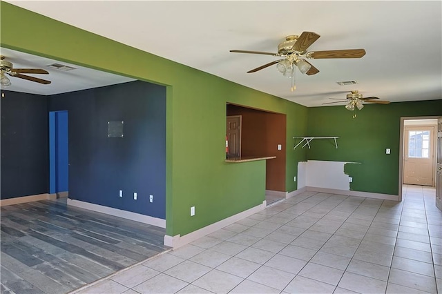 spare room with light tile patterned floors