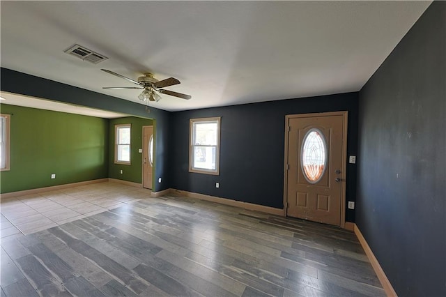 entrance foyer featuring ceiling fan and light wood-type flooring