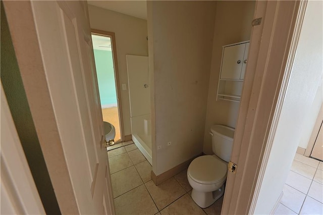 bathroom featuring tile patterned floors and toilet