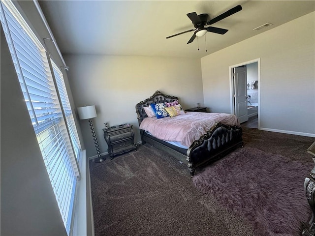 carpeted bedroom featuring visible vents, baseboards, and a ceiling fan