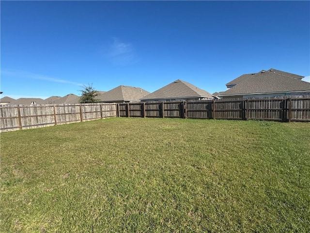 view of yard featuring a fenced backyard