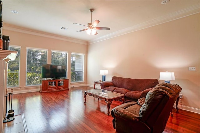 living room featuring dark hardwood / wood-style floors, ceiling fan, and crown molding