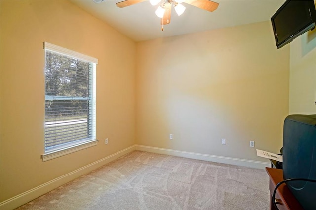 empty room with ceiling fan and light colored carpet