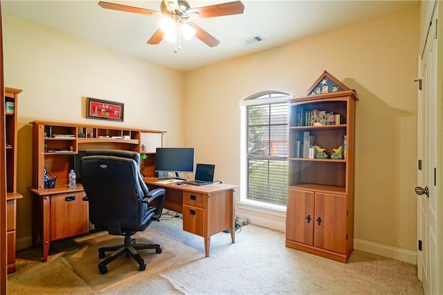 home office featuring ceiling fan and light colored carpet