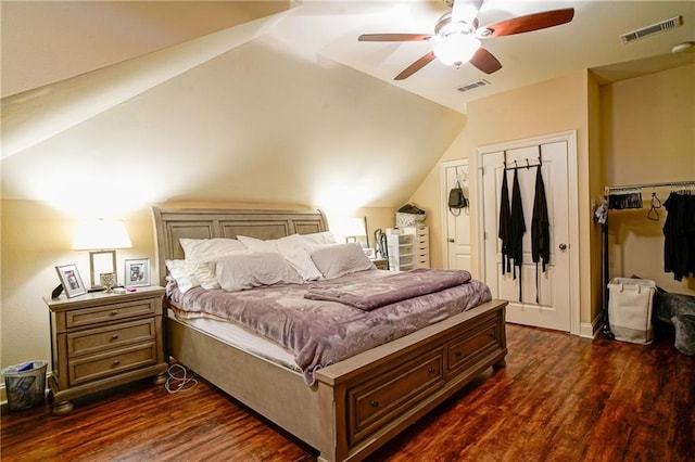 bedroom featuring ceiling fan, dark wood-type flooring, and vaulted ceiling