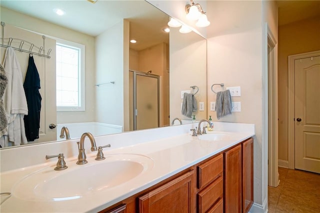 bathroom with tile patterned flooring, vanity, and a shower with shower door