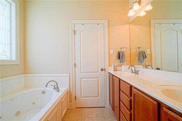 bathroom with tile patterned floors, vanity, and a bathtub