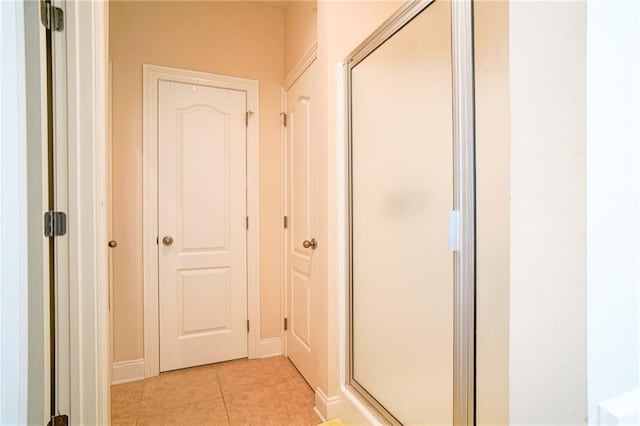 hallway with light tile patterned floors