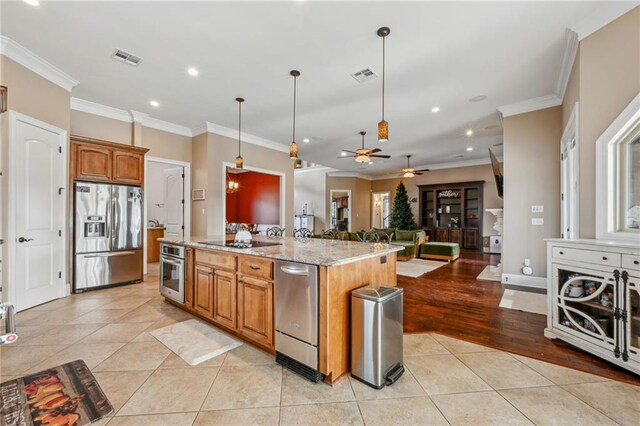 living area with crown molding, light tile patterned flooring, and a notable chandelier