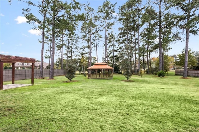 view of yard featuring a pergola and a gazebo