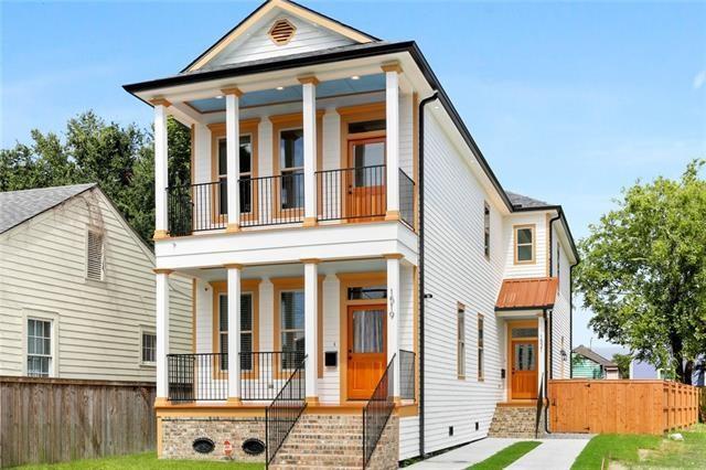 1519-21 N Villere St, New Orleans, LA 70116 - greek revival house with covered porch, a balcony, and crawl space