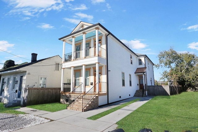 1519-21 N Villere St, New Orleans, LA 70116 - view of front of house featuring a balcony, crawl space, and covered porch