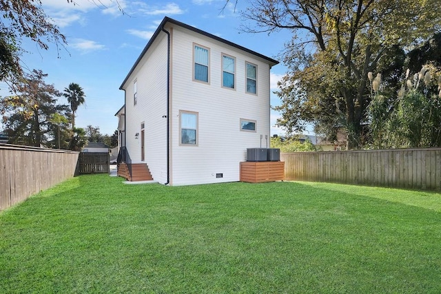 rear view of house with a lawn