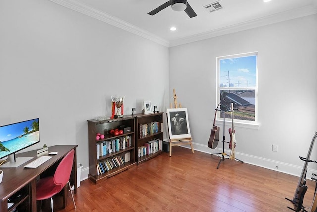 office space featuring hardwood / wood-style flooring, ceiling fan, and crown molding