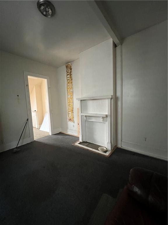 unfurnished living room with carpet flooring