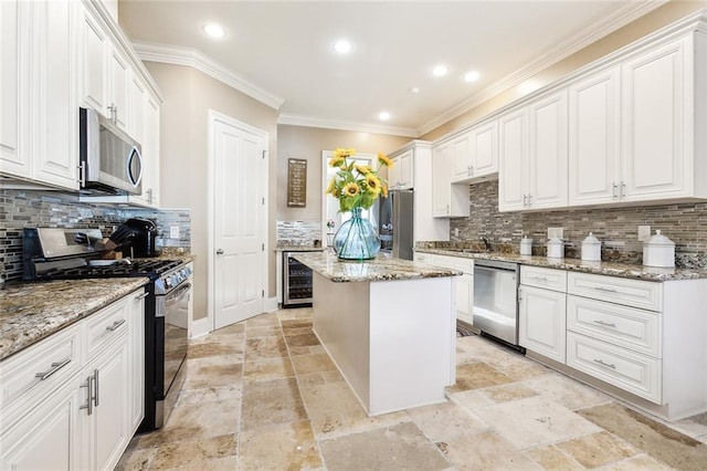 kitchen with light stone countertops, a center island, and stainless steel appliances