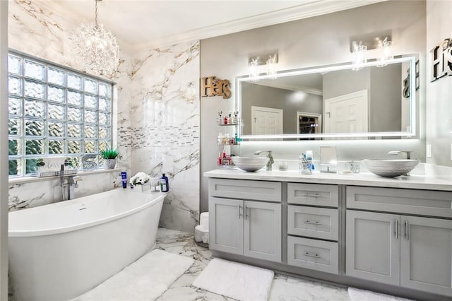 bathroom featuring a bathing tub, crown molding, vanity, and tile walls