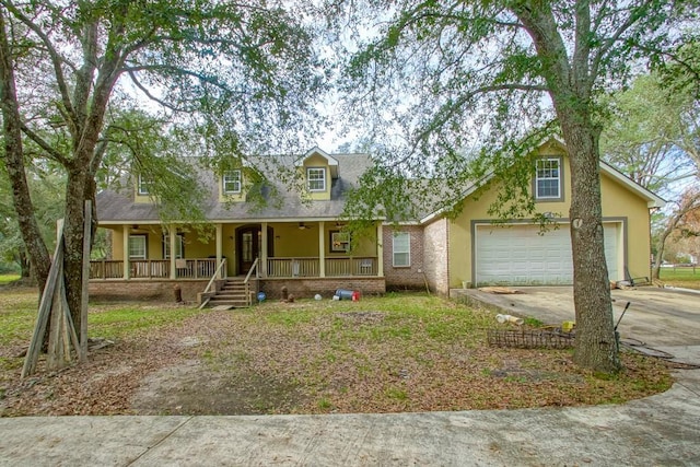 view of front facade with covered porch and a garage