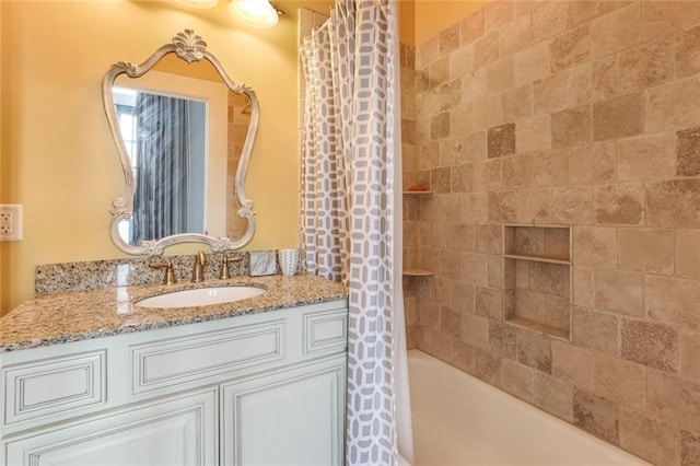 bathroom with vanity and shower / bathtub combination with curtain