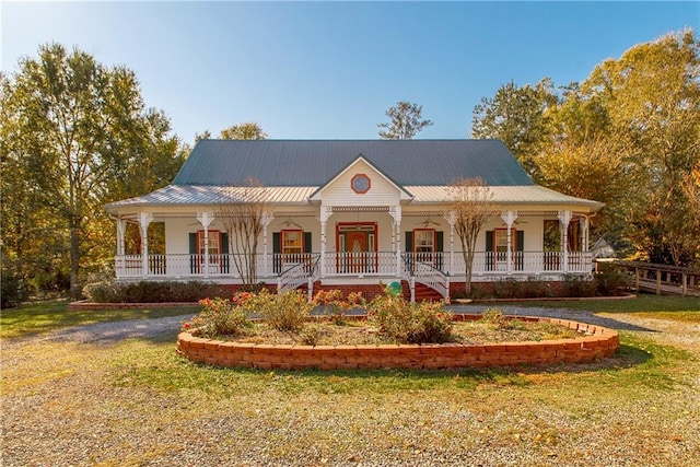 view of front of home featuring covered porch and a front yard