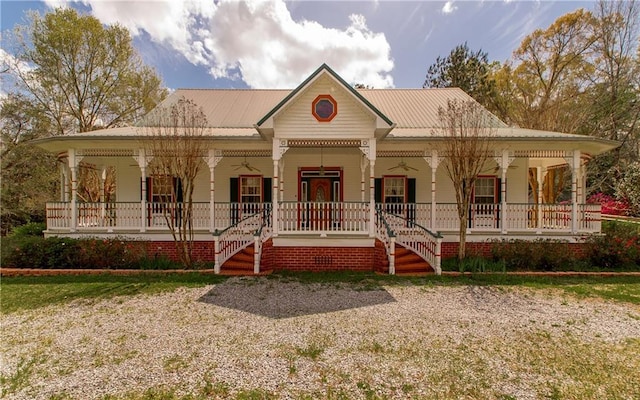15070 Bruhl Rd, Folsom, LA 70437 - country-style home with covered porch and metal roof