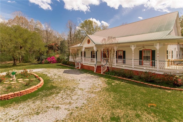 15070 Bruhl Rd, Folsom, LA 70437 - view of side of property featuring a porch, metal roof, and a yard