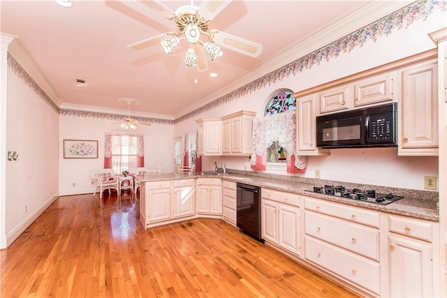 15070 Bruhl Rd, Folsom, LA 70437 - kitchen with a peninsula, black appliances, ceiling fan, and ornamental molding