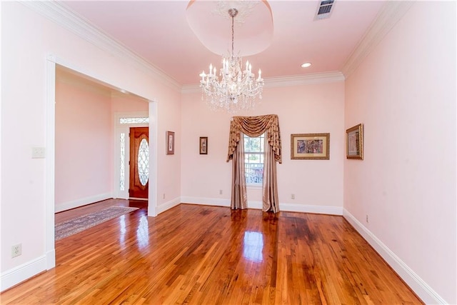 15070 Bruhl Rd, Folsom, LA 70437 - spare room with light wood finished floors, visible vents, baseboards, a chandelier, and ornamental molding