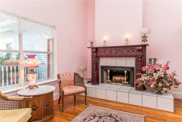 15070 Bruhl Rd, Folsom, LA 70437 - sitting room featuring wood finished floors, baseboards, and a tile fireplace
