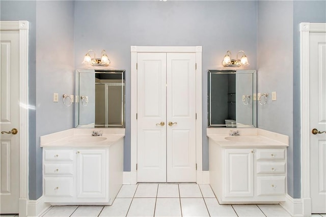 15070 Bruhl Rd, Folsom, LA 70437 - bathroom featuring tile patterned flooring, two vanities, and a sink
