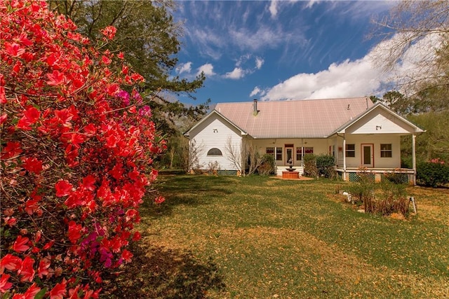 15070 Bruhl Rd, Folsom, LA 70437 - rear view of house featuring a porch, a yard, and metal roof