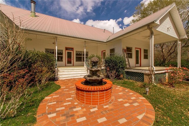 15070 Bruhl Rd, Folsom, LA 70437 - rear view of house featuring metal roof and covered porch