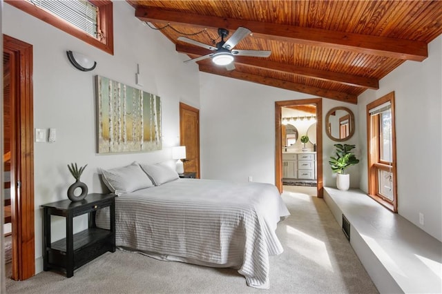 bedroom with ceiling fan, wooden ceiling, vaulted ceiling with beams, ensuite bathroom, and light carpet