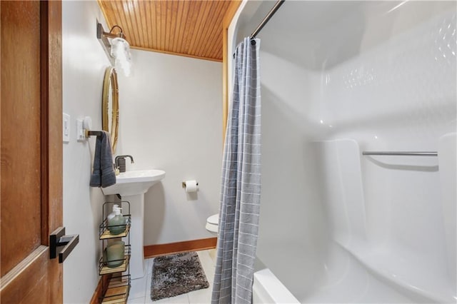 bathroom featuring tile patterned floors, shower / tub combo with curtain, wooden ceiling, and toilet