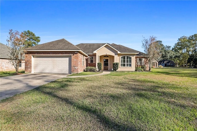 ranch-style house featuring a garage and a front yard