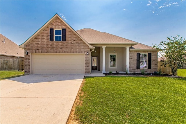 view of front of home featuring a front yard and a garage