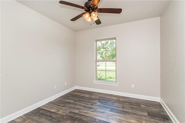 spare room featuring dark hardwood / wood-style floors and ceiling fan