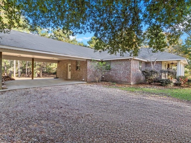 ranch-style house featuring a carport